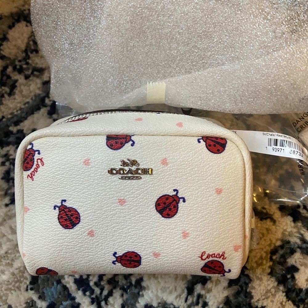 Coach NWT mini ladybug cosmetic bag.